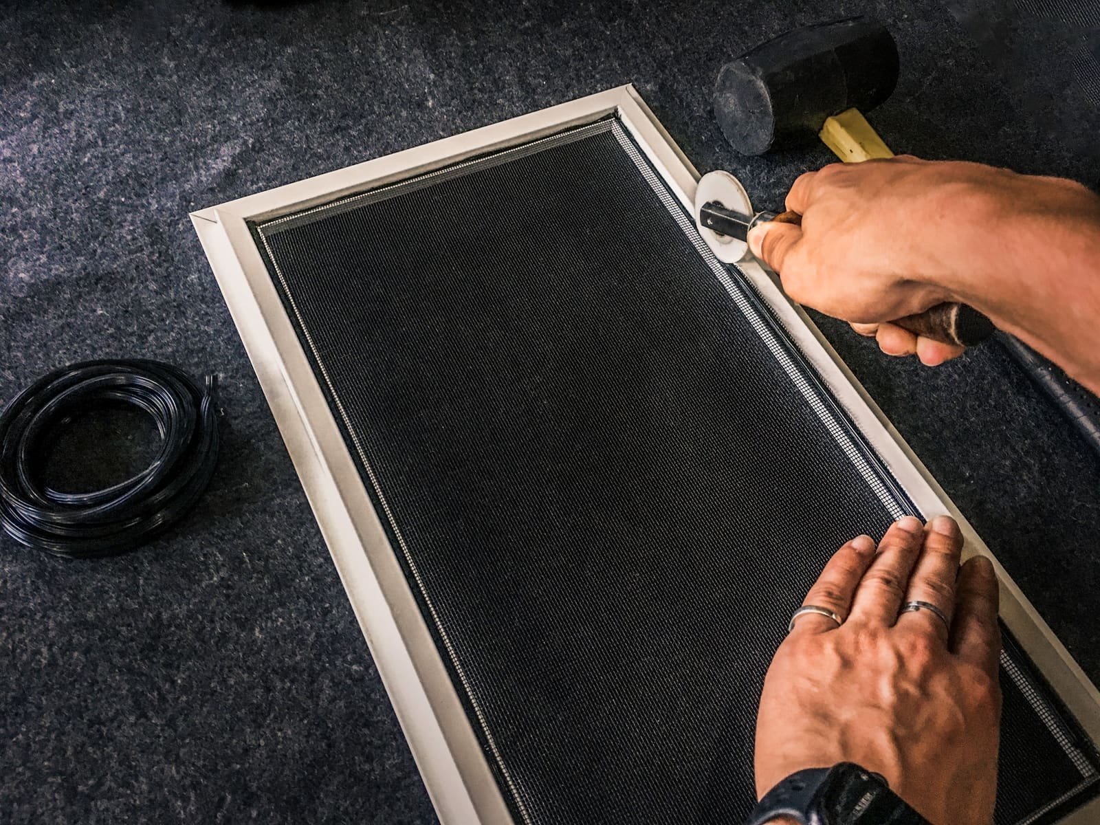 New mesh being fitted into the frame in Curaçao