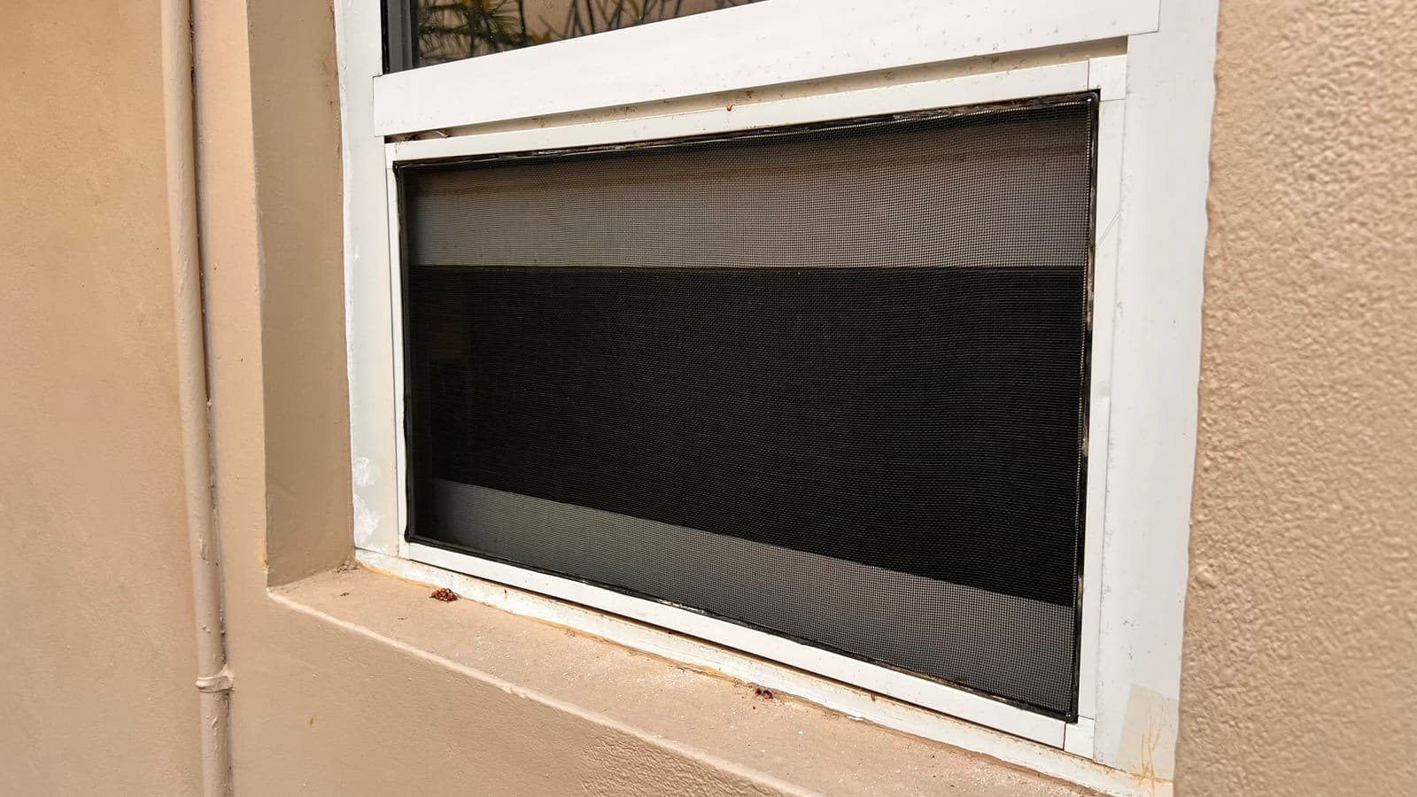 New insect mesh in a window frame in Curaçao
