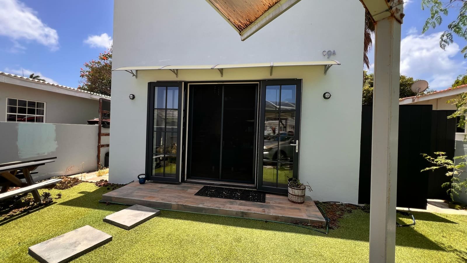 Sliding insect screen, two panels on two rails, custom color in Curaçao